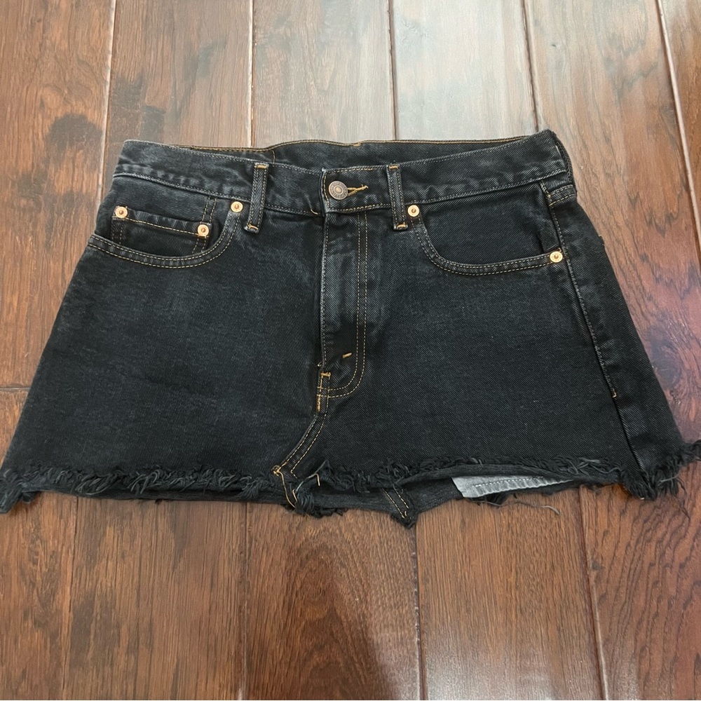 Urban Outfitters black denim mini skirt.